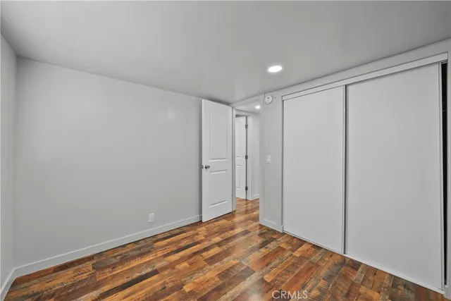 a view of hallway with wooden floor