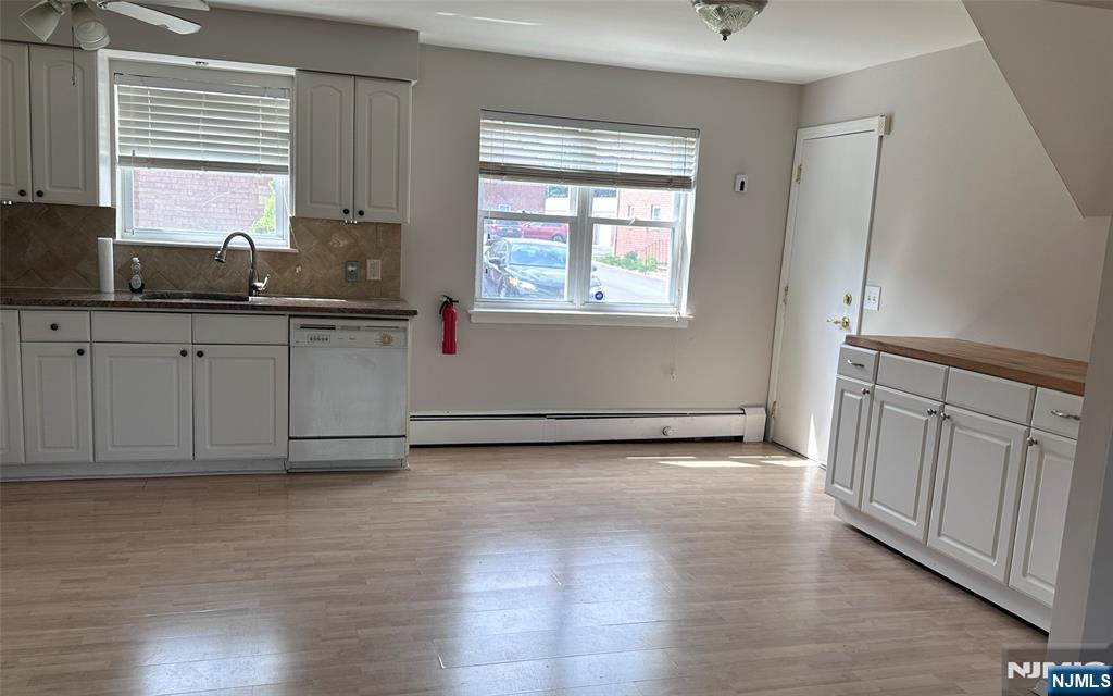 1165 A Valley Road, Unit 1165A Wayne, NJ 07470 - Photo 9 of 22 a view of a kitchen with wooden floor and a window