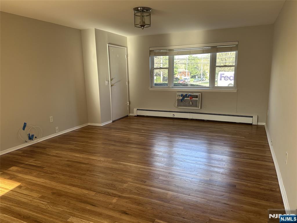 1165 A Valley Road, Unit 1165A Wayne, NJ 07470 - Photo 10 of 22 an empty room with wooden floor and windows