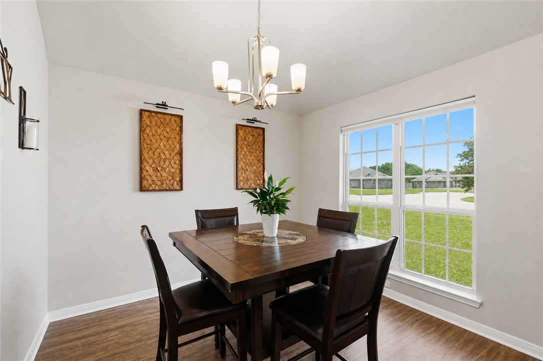 2725 Porter's Way Bryan, TX 77803 - Photo 5 of 19 a view of a dining room with furniture window and wooden floor