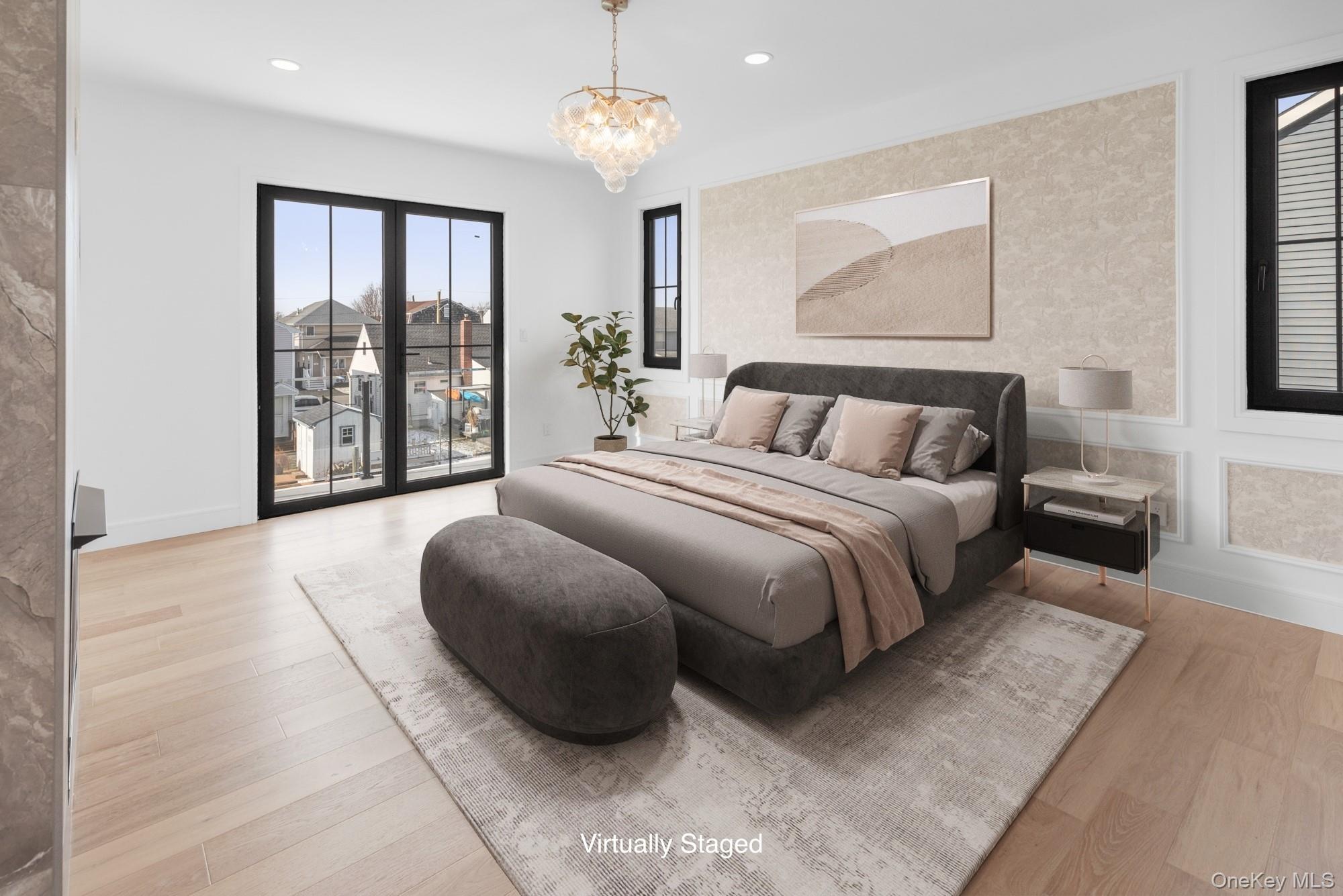 24 Midway Street Babylon, NY 11702 - Photo 28 of 40 Bedroom featuring light wood finished floors, access to outside, a chandelier, and recessed lighting