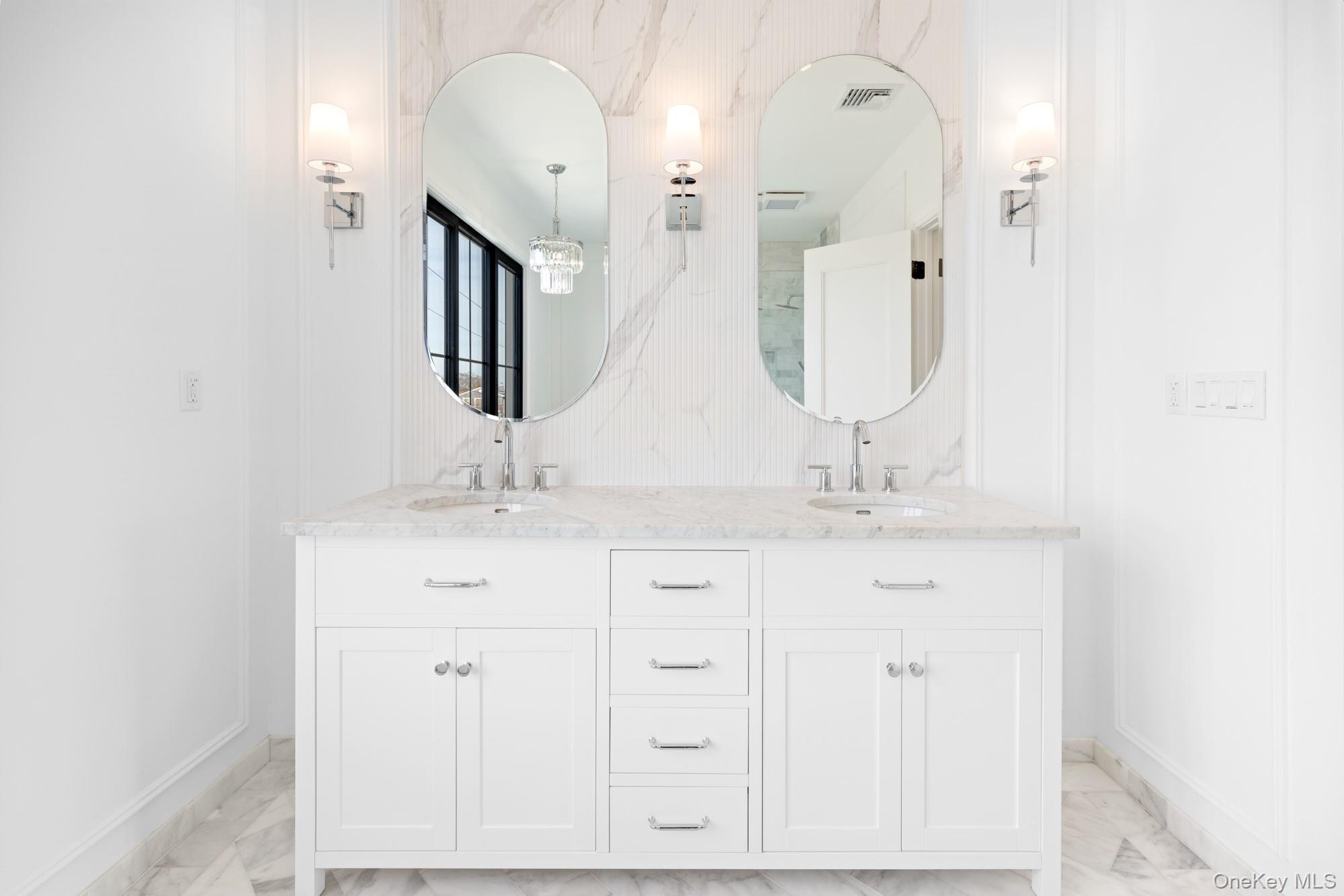 24 Midway Street Babylon, NY 11702 - Photo 33 of 40 Full bath with double vanity and light marble finish flooring