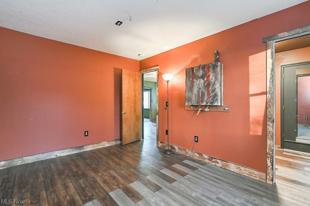 4802 Beach Road Medina, OH 44256 - Photo 21 of 35 Empty room with hardwood / wood-style floors