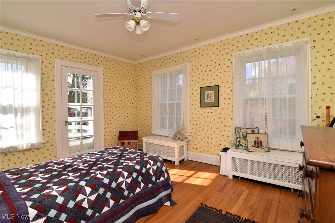 2887 Kingsley Road Shaker Heights, OH 44122 - Photo 25 of 40 This Bedroom features a ceiling fan, 3 windows and a doorway out to the flat roof.