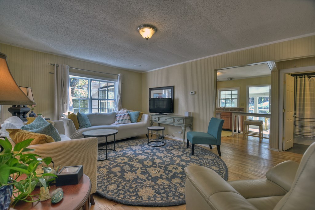 3380 Clear Creek Road Ellijay, GA 30536 - Photo 15 of 39 a living room with furniture wooden floor and a window