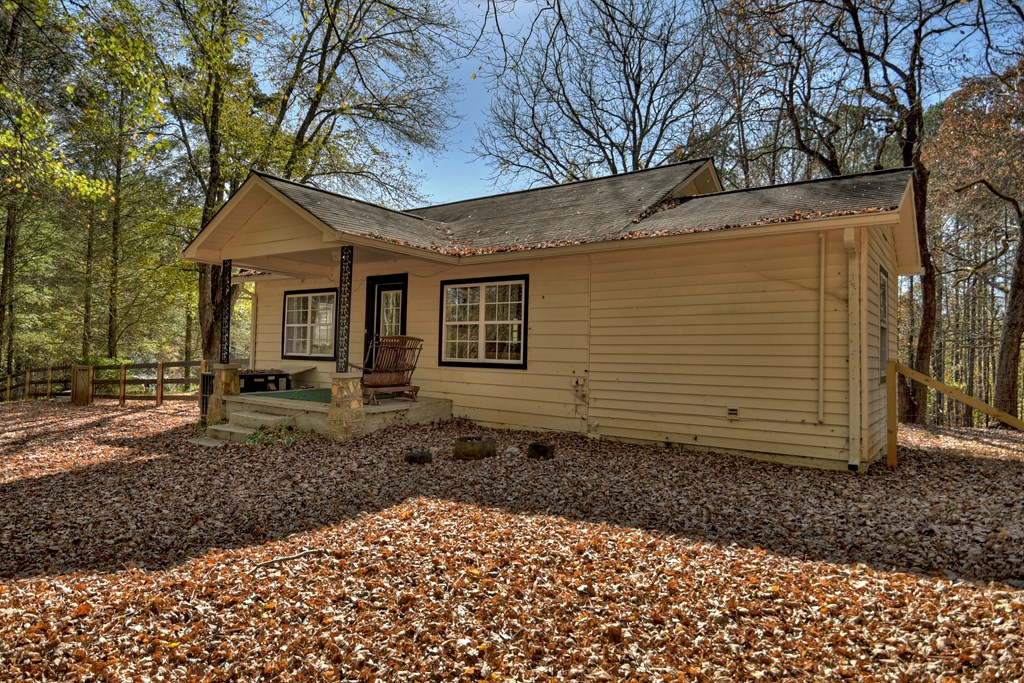 3380 Clear Creek Road Ellijay, GA 30536 - Photo 17 of 39 a view of a house with a yard