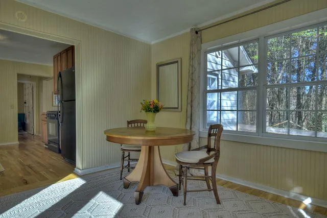a kitchen with granite countertop a sink cabinets and window