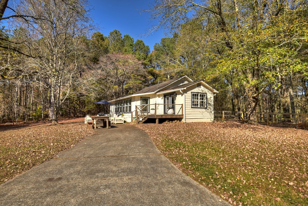 3380 Clear Creek Road Ellijay, GA 30536 - Photo 2 of 39 a house with trees in the background