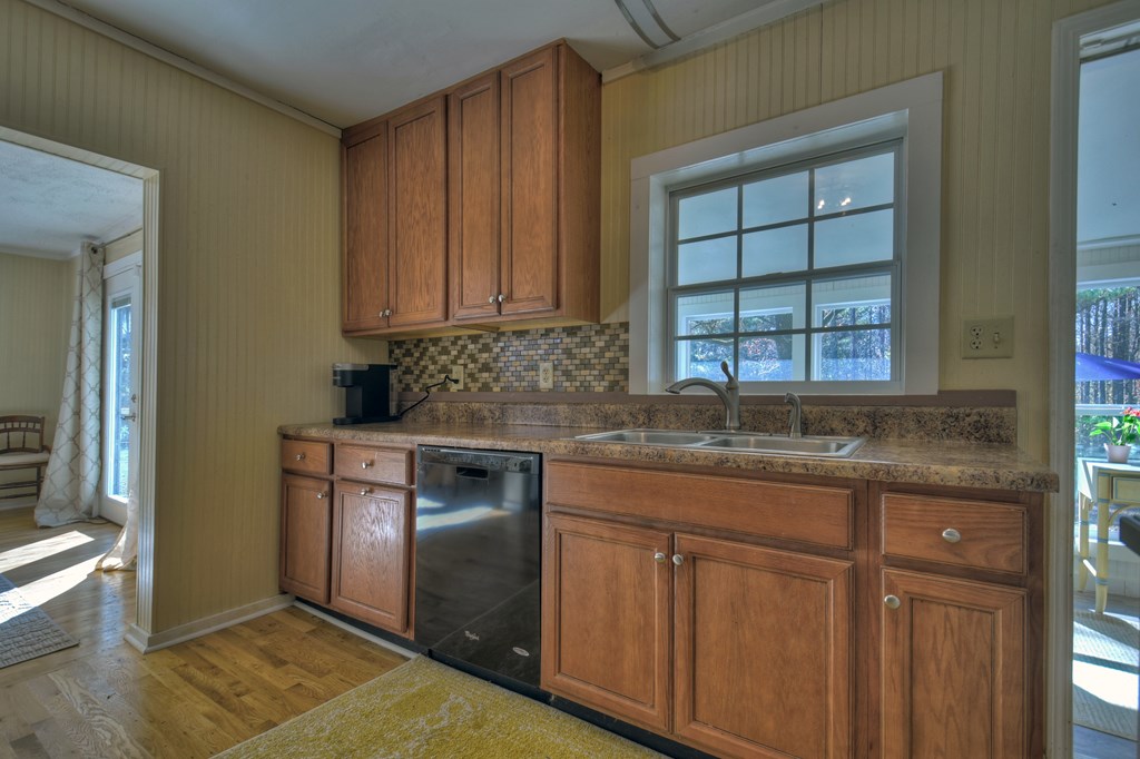 3380 Clear Creek Road Ellijay, GA 30536 - Photo 21 of 39 a kitchen with granite countertop cabinets stainless steel appliances a sink and a window