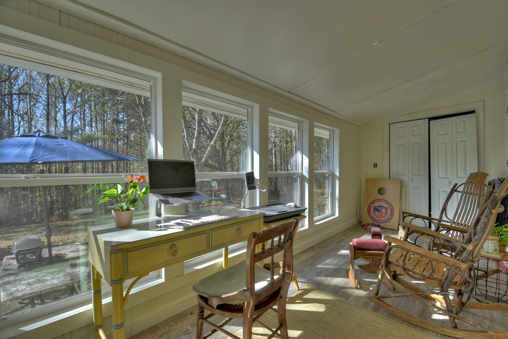 3380 Clear Creek Road Ellijay, GA 30536 - Photo 25 of 39 a room with furniture a flat screen tv and a window