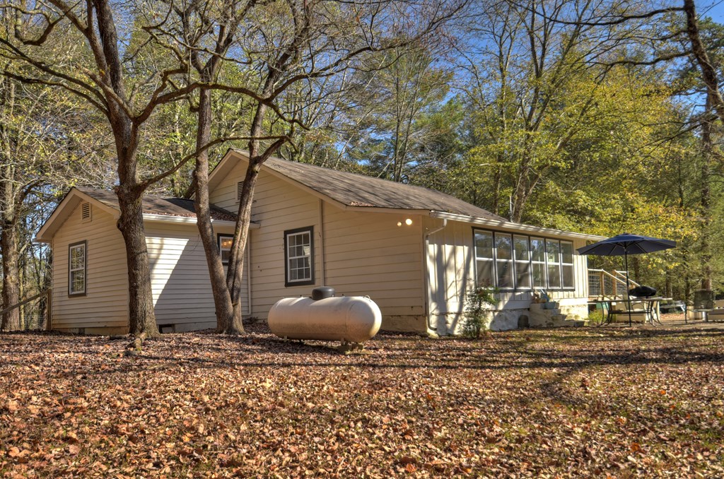 3380 Clear Creek Road Ellijay, GA 30536 - Photo 7 of 39 a backyard of a house with barbeque oven