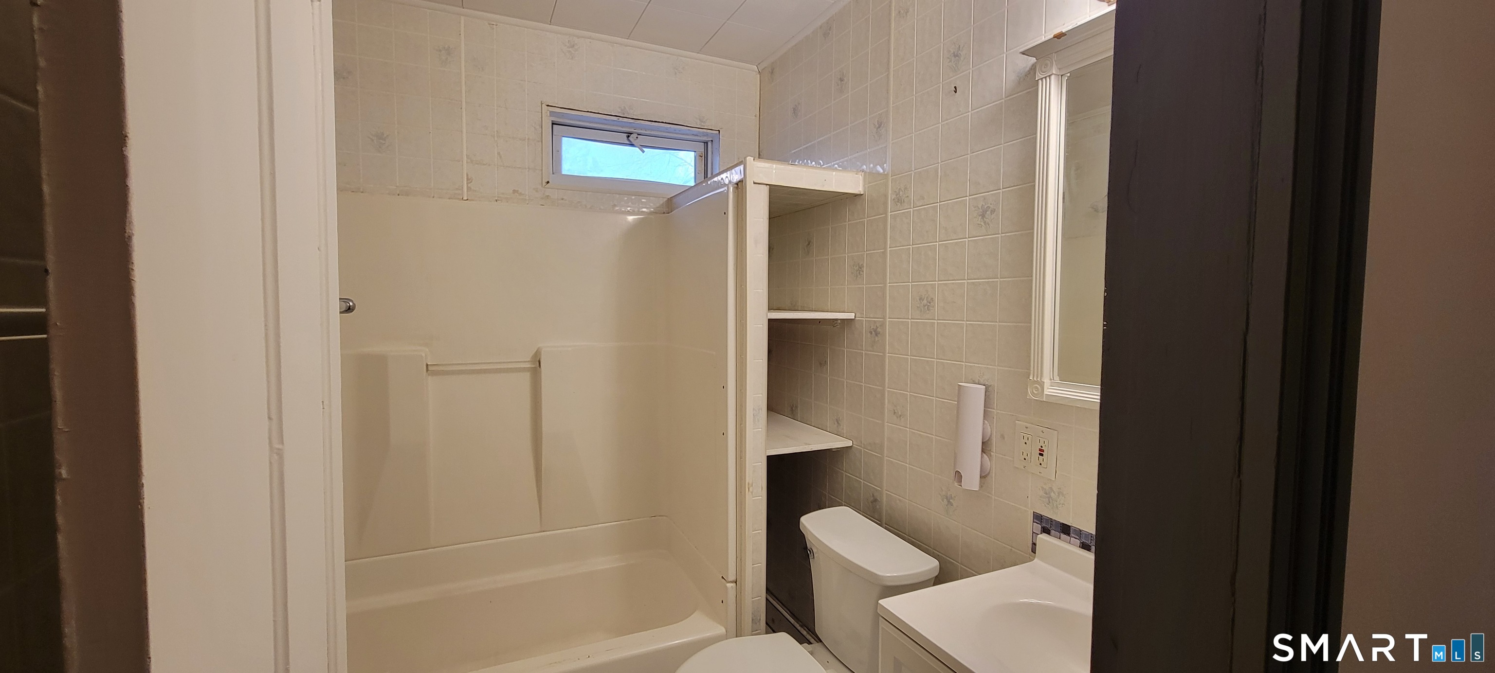 130 Church Street Bristol, CT 06010 - Photo 11 of 22 a bathroom with a shower and toilet