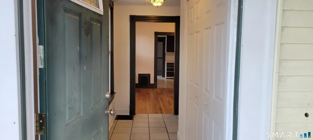 a view of a bathroom from a hallway