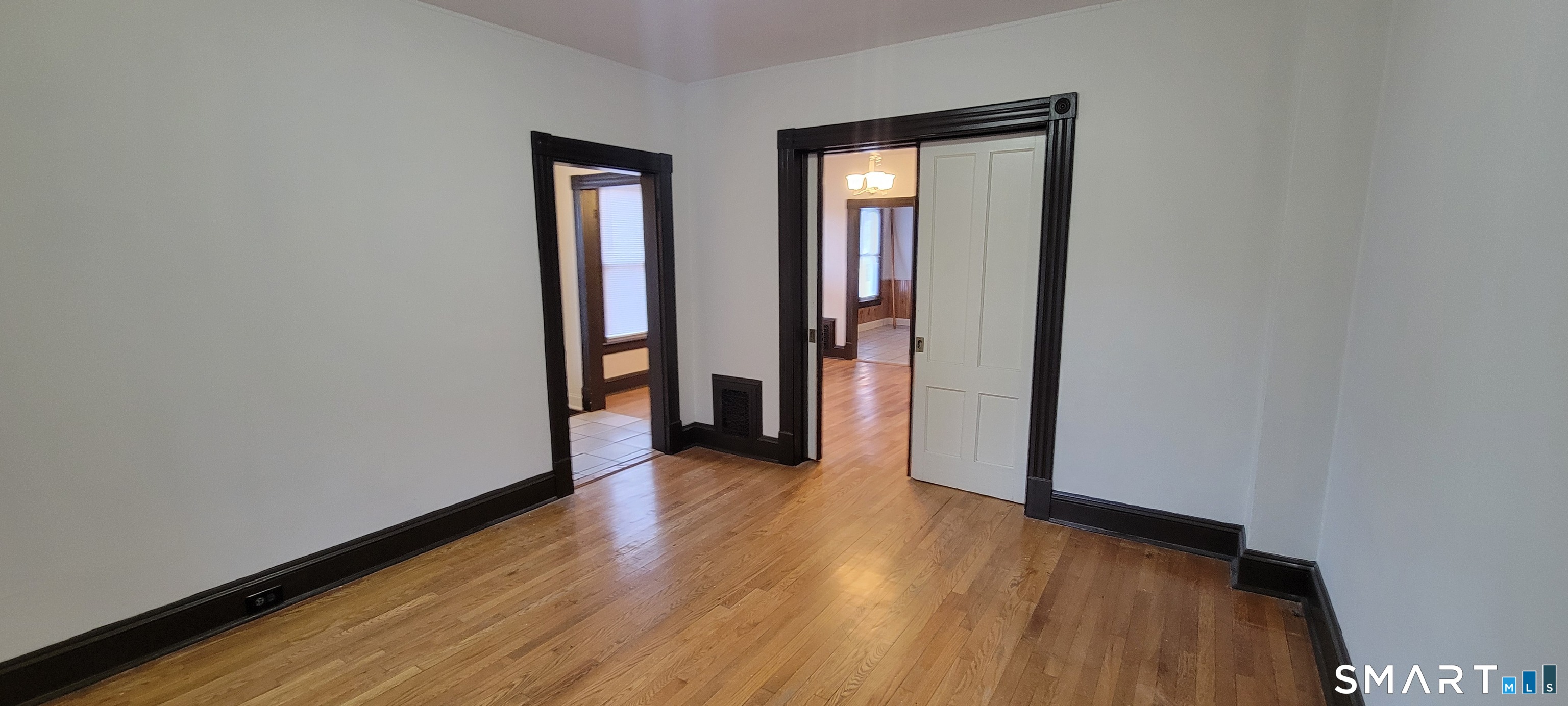 130 Church Street Bristol, CT 06010 - Photo 5 of 22 a view of a hallway with wooden floor