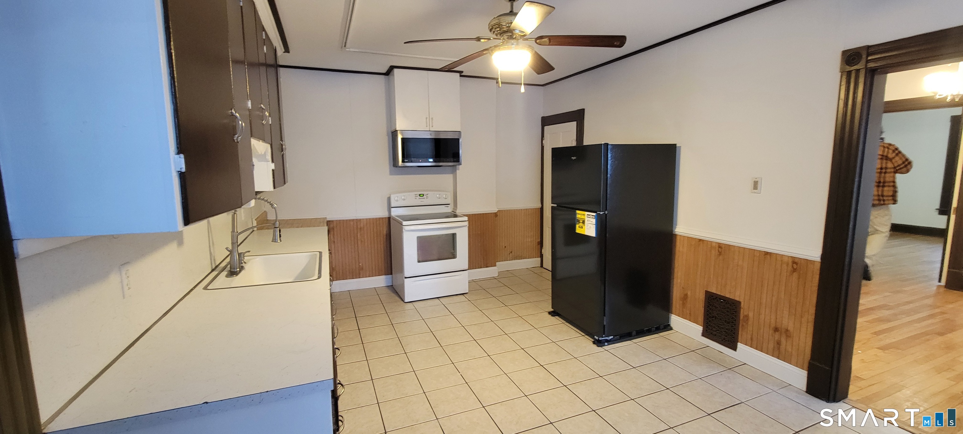 130 Church Street Bristol, CT 06010 - Photo 7 of 22 a kitchen with stainless steel appliances granite countertop a refrigerator and a sink