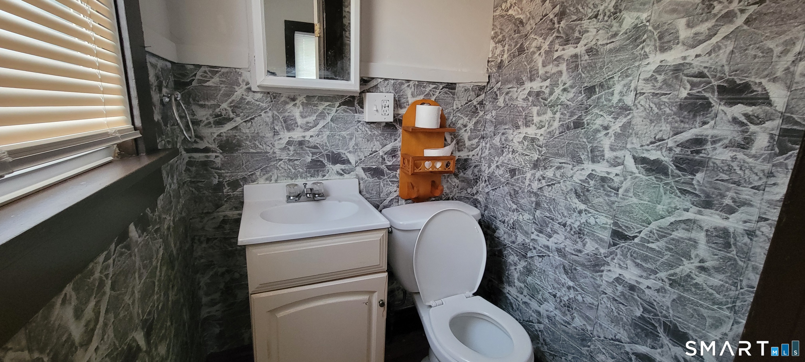 130 Church Street Bristol, CT 06010 - Photo 10 of 22 a bathroom with a toilet and a sink