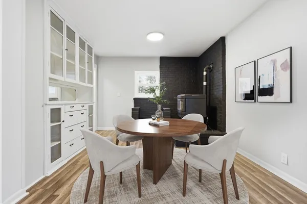a dining room with a table and chairs