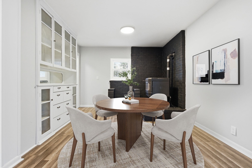 17 West High Street Erving, MA 01344 - Photo 4 of 12 a dining room with a table and chairs