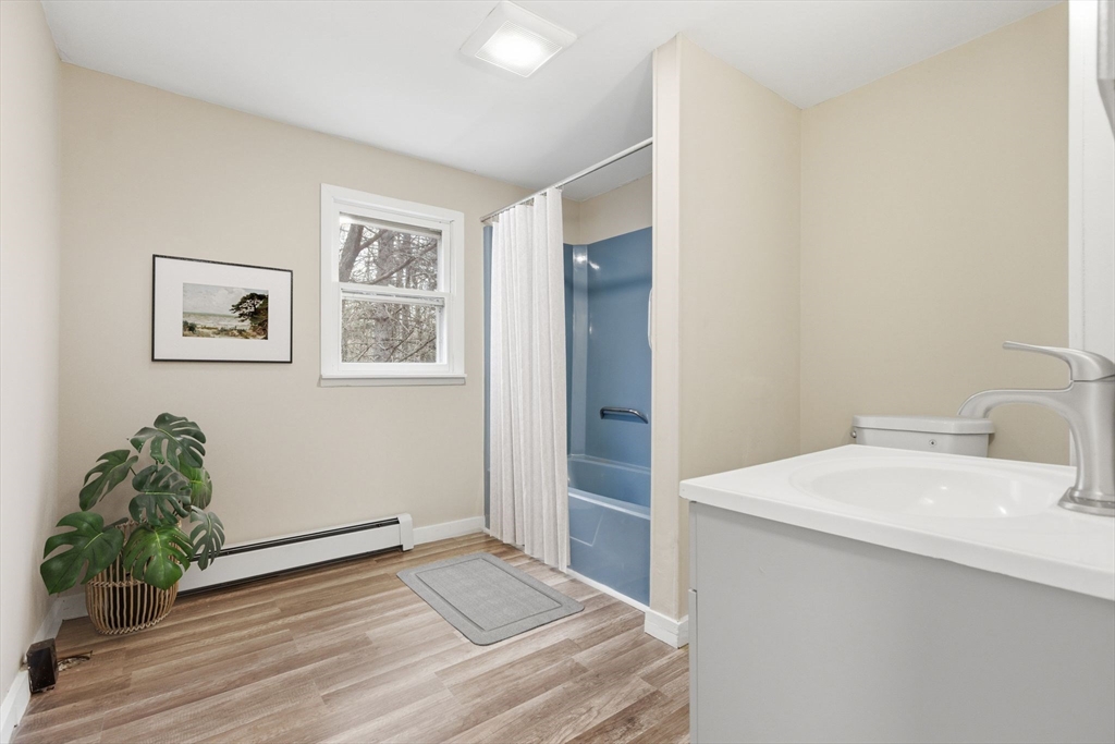 17 West High Street Erving, MA 01344 - Photo 6 of 12 a room with a sink and a mirror