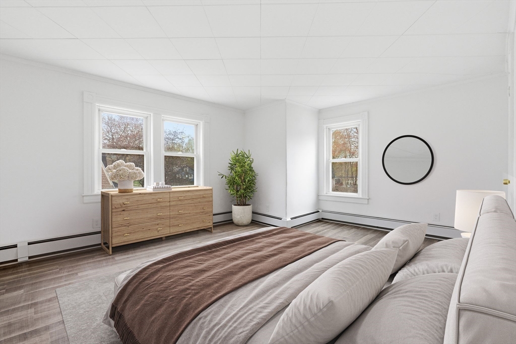 17 West High Street Erving, MA 01344 - Photo 7 of 12 a bedroom with a bed mirror and window