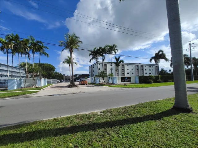 a view of a street with a building in the background