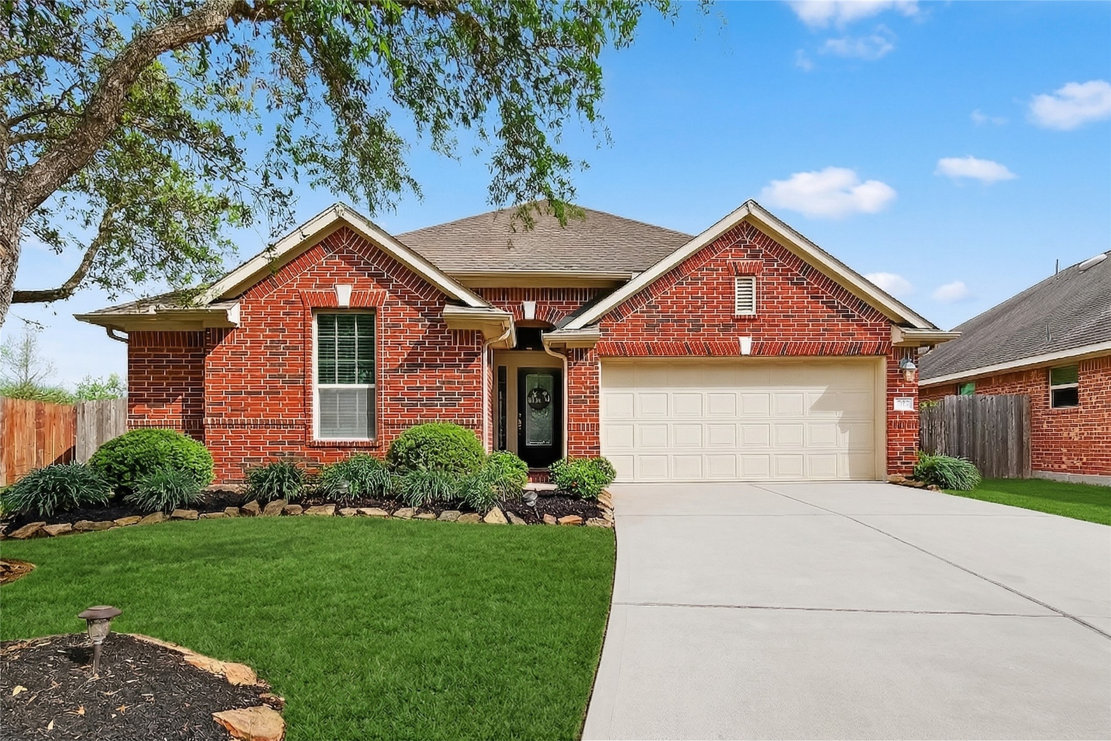 13415 Star Creek Lane Rosharon, TX 77583 - Photo 36 of 46 a front view of a house with a yard and garage