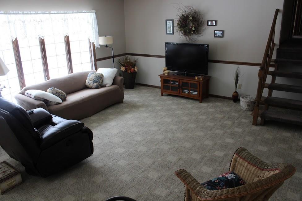 2424 Rutledge Road Transfer, PA 16154 - Photo 3 of 25 A large living room with Anderson Windows overlooking the lush landscape and wooded lot