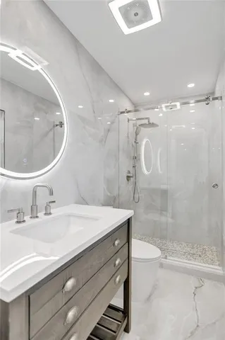 a kitchen with stainless steel appliances a refrigerator and a stove