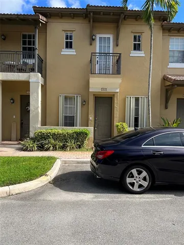 a car parked in front of a house