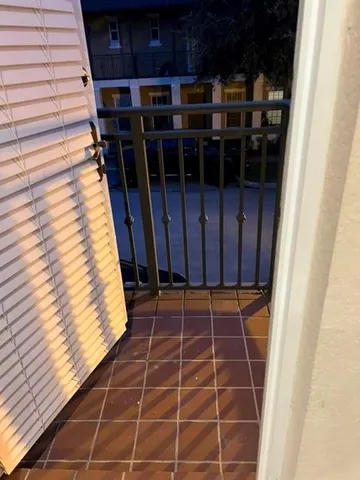 a view of a door with wooden floor