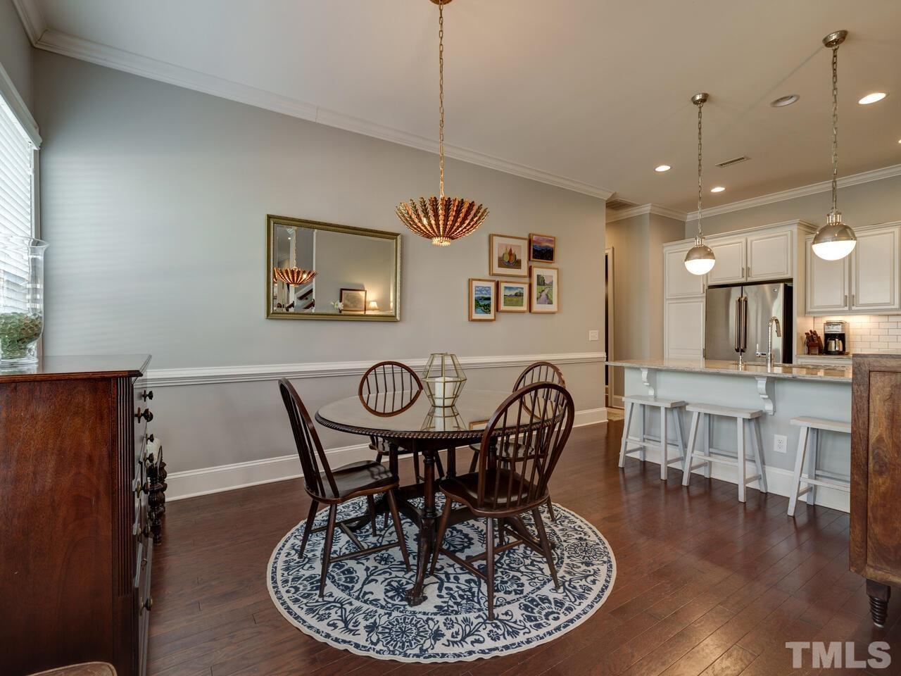 500 Deodar Lane Raleigh, NC 27608 - Photo 4 of 49 a view of a dining room with furniture window and wooden floor