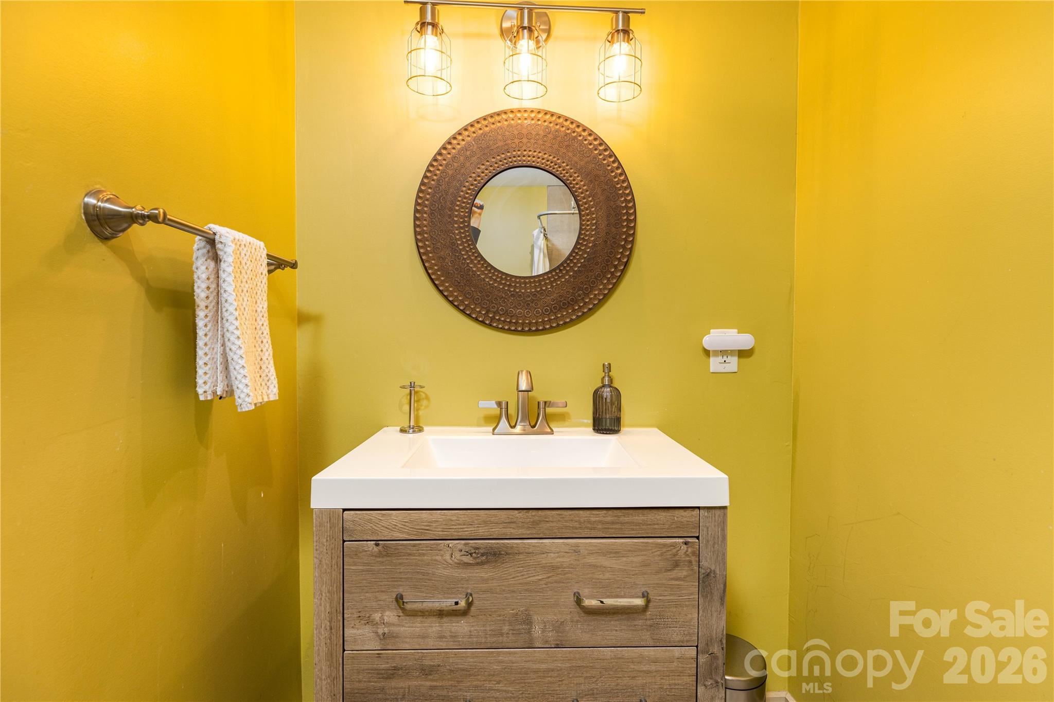 221 Pineville-Matthews Road Matthews, NC 28105 - Photo 17 of 29 a bathroom with a sink and a mirror