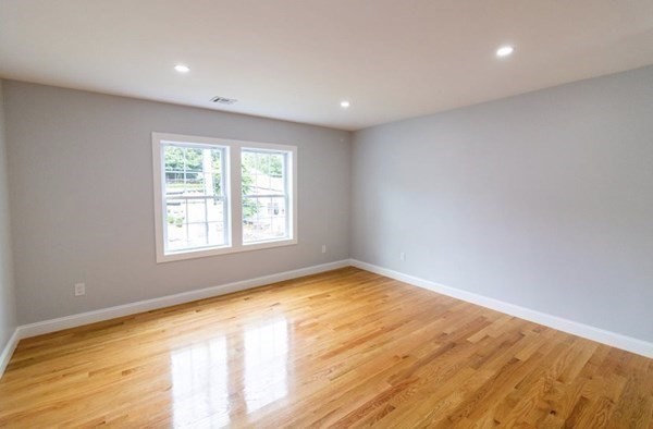 171 Hamilton Street Saugus, MA 01906 - Photo 18 of 42 a view of an empty room with wooden floor and a window
