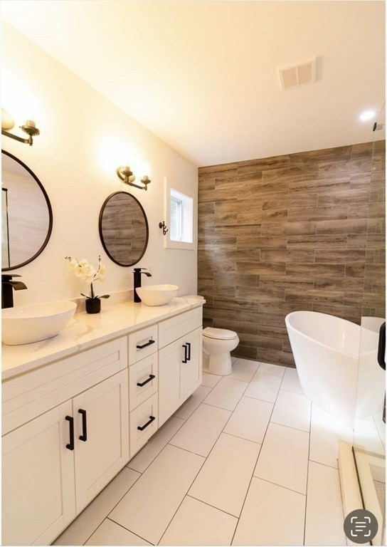 171 Hamilton Street Saugus, MA 01906 - Photo 23 of 42 a bathroom with a toilet a sink and mirror