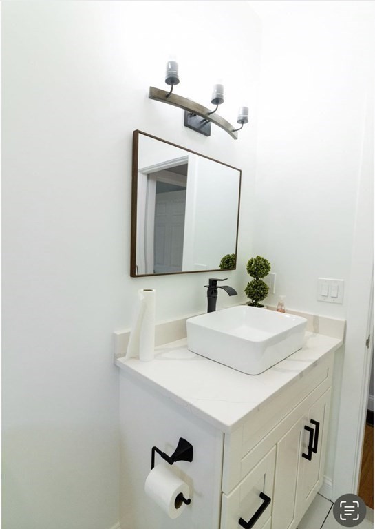171 Hamilton Street Saugus, MA 01906 - Photo 31 of 42 a bathroom with a sink and a mirror