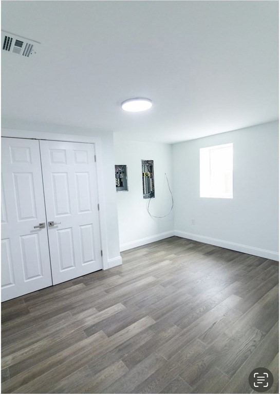 171 Hamilton Street Saugus, MA 01906 - Photo 38 of 42 an empty room with wooden floor and windows