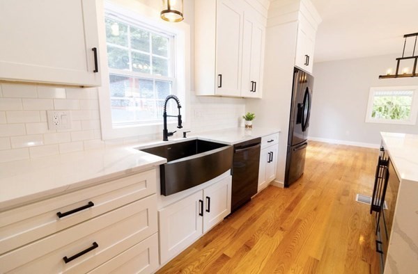171 Hamilton Street Saugus, MA 01906 - Photo 4 of 42 a kitchen with stainless steel appliances a sink a stove and a refrigerator