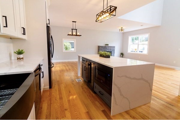 171 Hamilton Street Saugus, MA 01906 - Photo 5 of 42 a kitchen with a sink and wooden floor