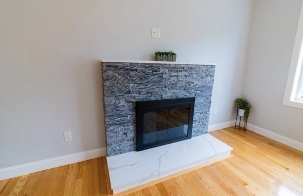 171 Hamilton Street Saugus, MA 01906 - Photo 8 of 42 a living room with a fireplace