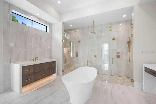 a bathroom with a toilet a sink and shower