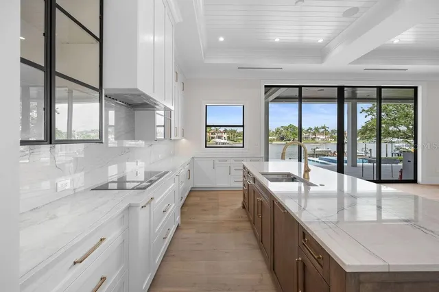 a utility room with sink dryer and washer