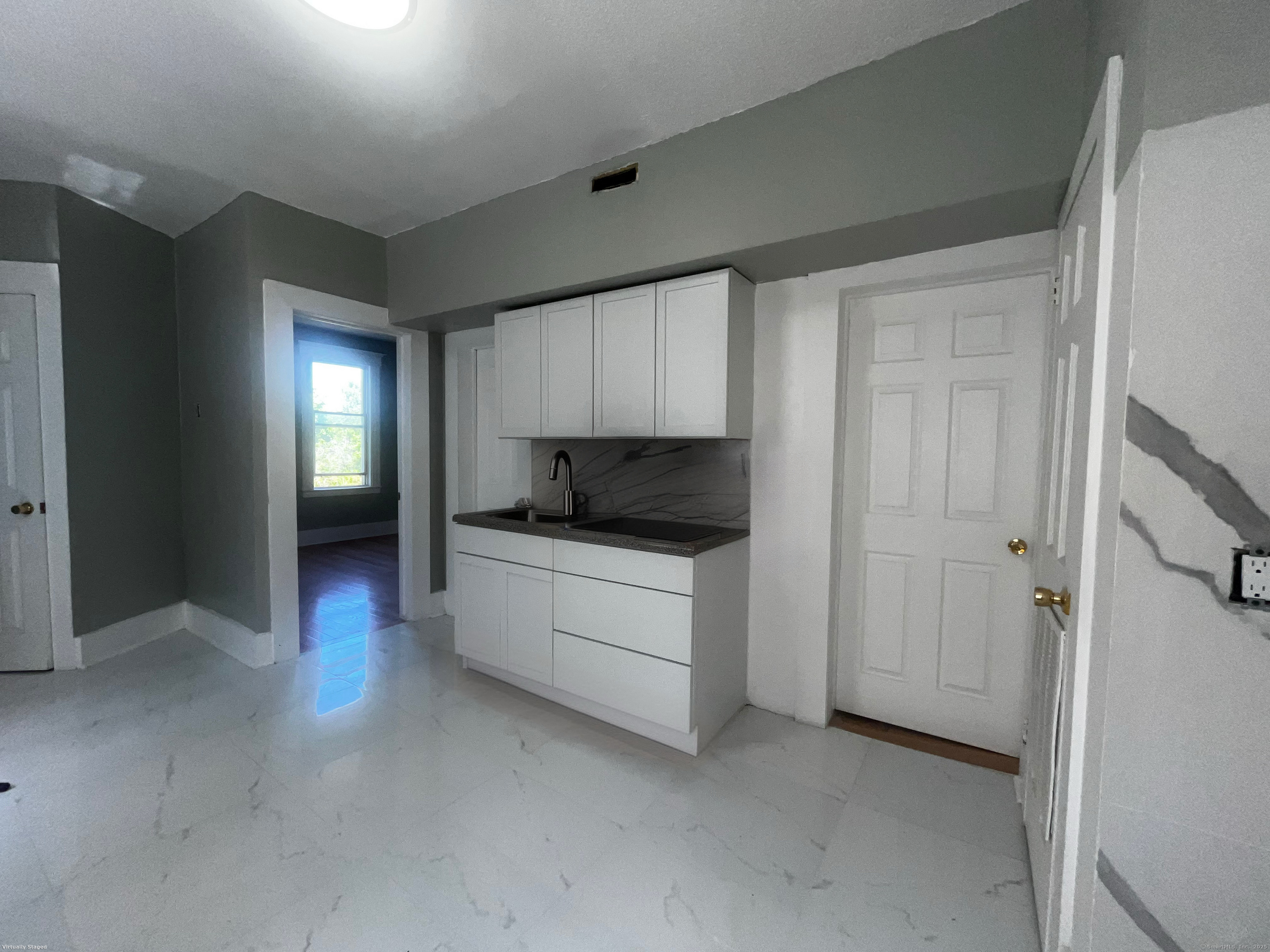 11 Truman Street, Unit 2 New Haven, CT 06519 - Photo 2 of 7 a living room with stainless steel appliances kitchen island granite countertop a refrigerator and a stove top oven