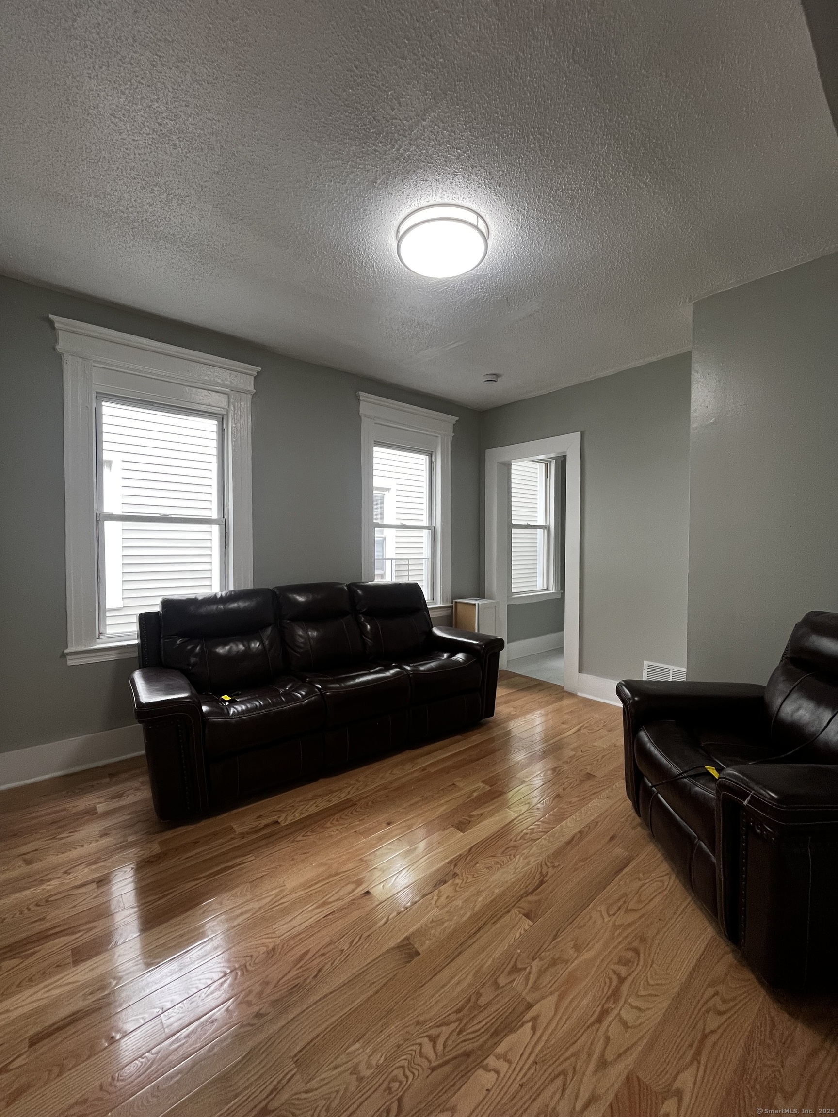11 Truman Street, Unit 2 New Haven, CT 06519 - Photo 4 of 7 a living room with furniture and wooden floor