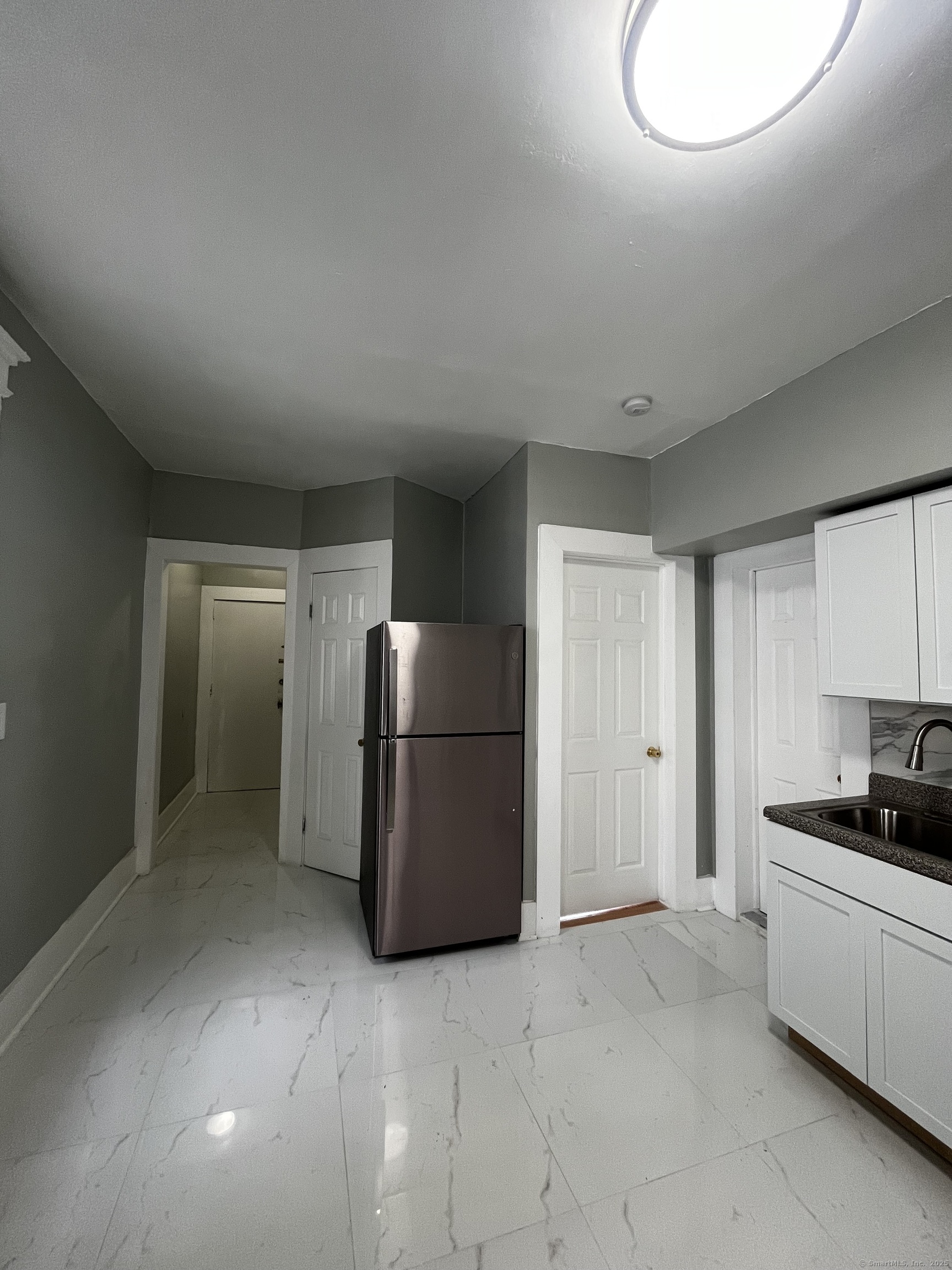 11 Truman Street, Unit 2 New Haven, CT 06519 - Photo 6 of 7 a kitchen with a refrigerator and a stove top oven