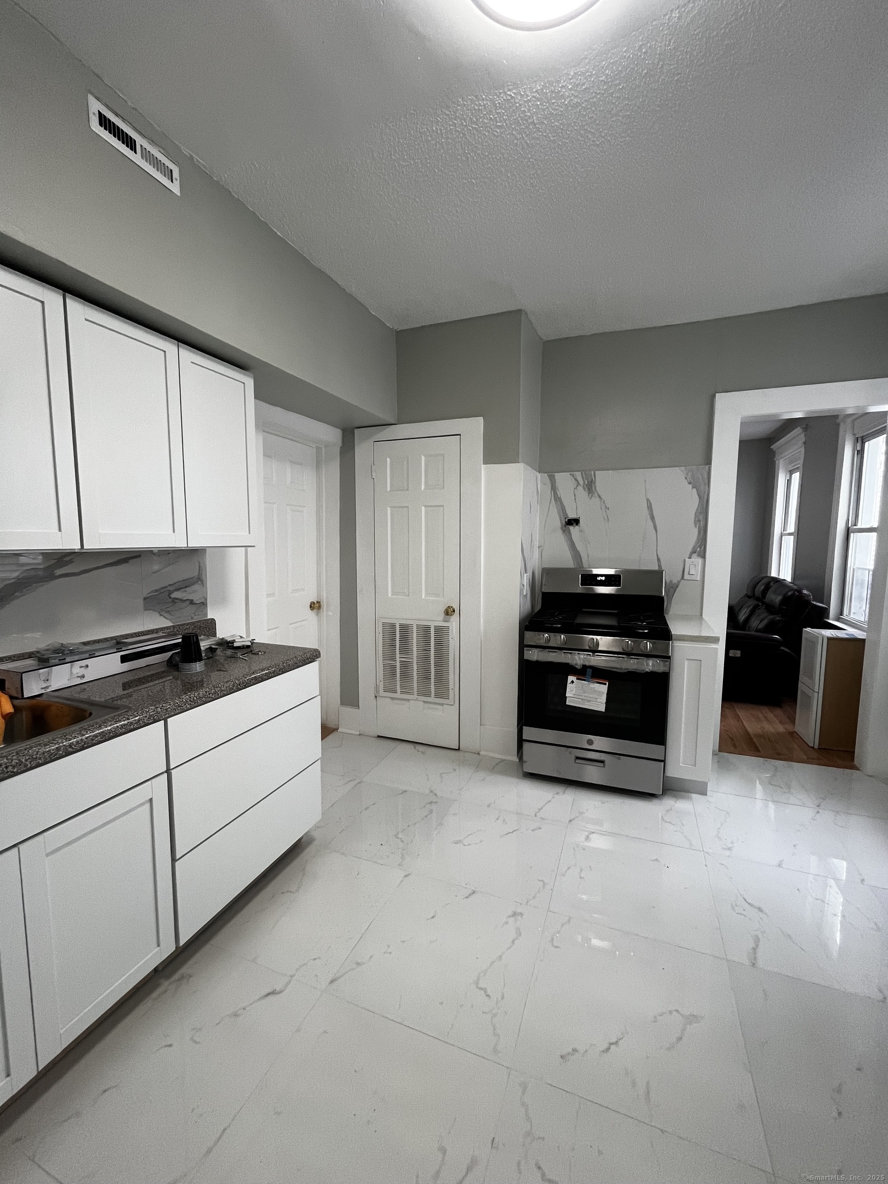 11 Truman Street, Unit 2 New Haven, CT 06519 - Photo 7 of 7 a living room with furniture and a flat screen tv