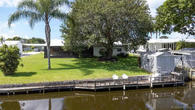 a view of house with swimming pool and a large pool