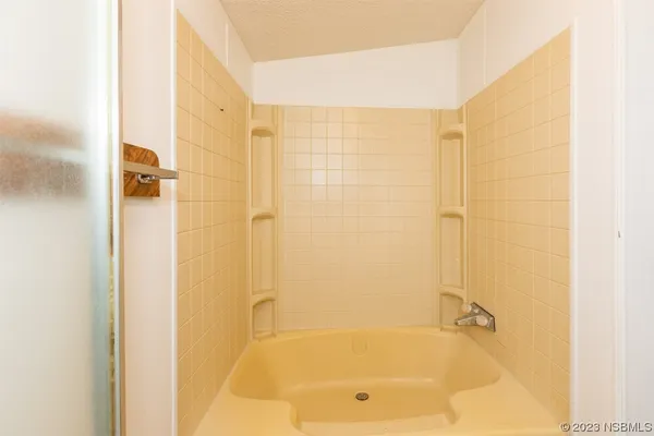 a view of a hallway with a room