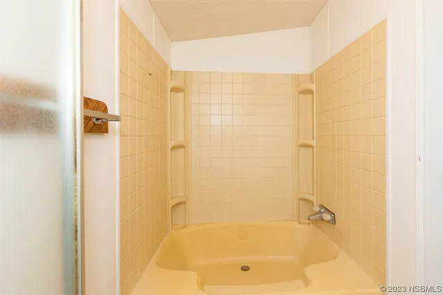 a view of a hallway with a room