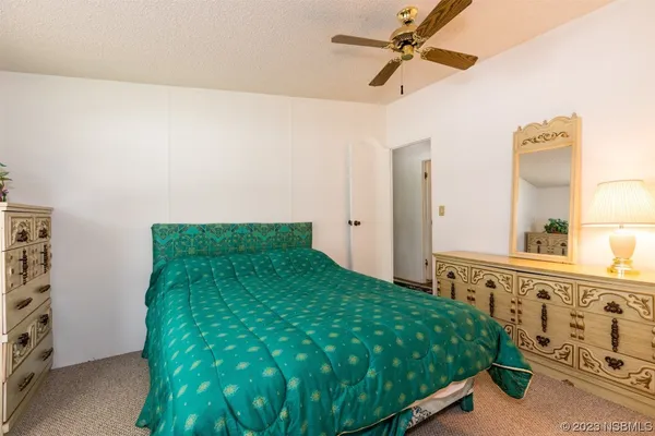 a bedroom with bed and a window