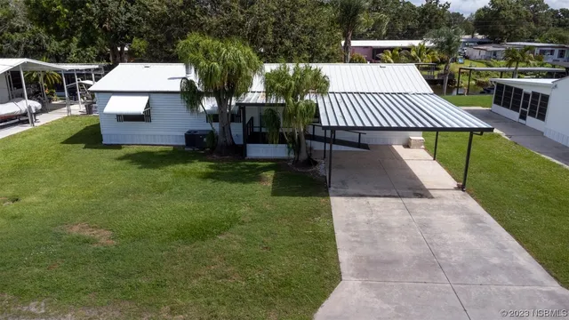 a view of a patio with a yard